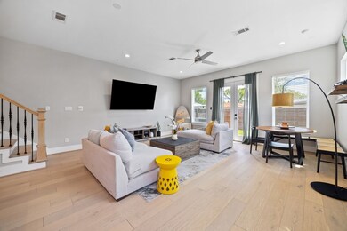 Elegant living and dining space with large windows