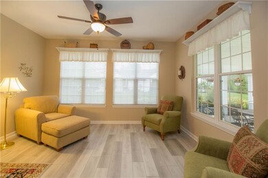 Lovely, bright sun room over looks covered patio a