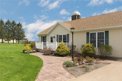 Inviting stamped concrete walkway leads to the fro