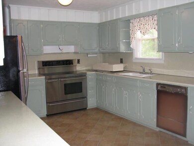 Large kitchen. Buyer will need a new dishwasher.
