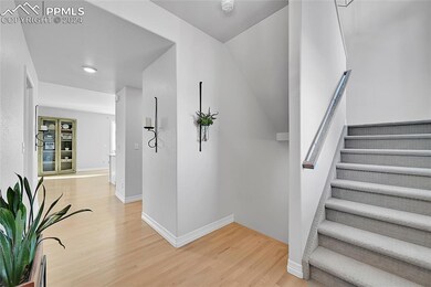 Staircase featuring light wood-type flooring