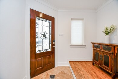 This welcoming entryway features a beautiful woode