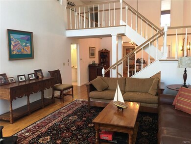 Living room with dining room on other side of stai
