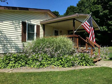 Exterior Front. newly stained covered side porch