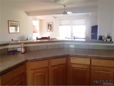 Kitchen featuring natural light, brown cabinetry,