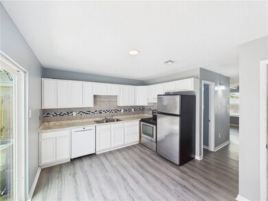 Kitchen featuring appliances with stainless steel