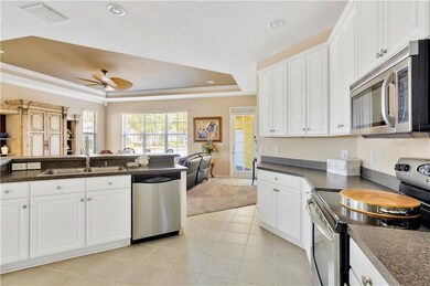 WIDE-OPEN KITCHEN WITH STAINLESS APPLIANCES