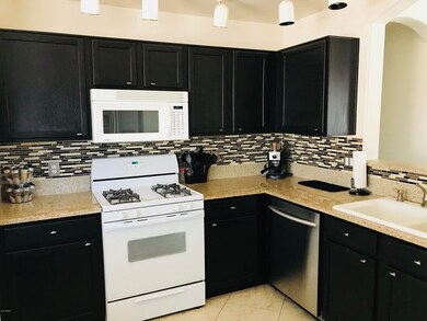 Kitchen with tile backsplash