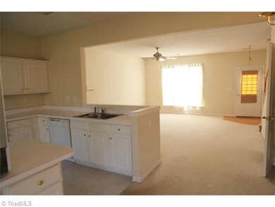 Kitchen. View toward the living room from the dining area.