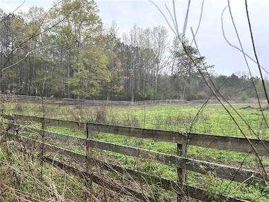 View of yard featuring a view of trees and a view of rural / pastoral area
