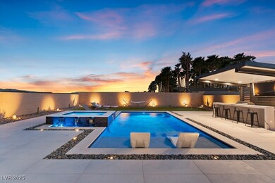 Pool at dusk featuring a fenced backyard, a pool w