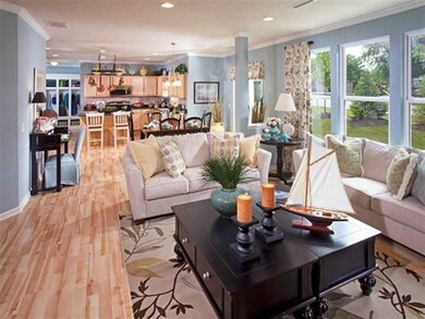Family Room. Photo is of a similar model & floor plan.