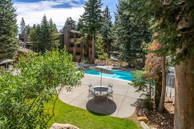 Community pool with a patio