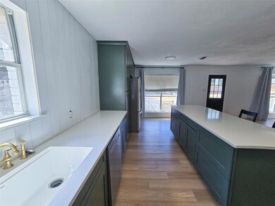 Kitchen with stainless steel dishwasher, hardwood 