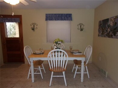 Kitchen. Spacious eat-in area with ceiling fan and