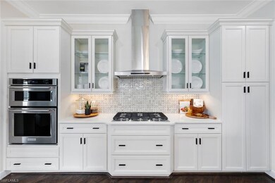 Kitchen with recently painted white cabinetry and new hardware