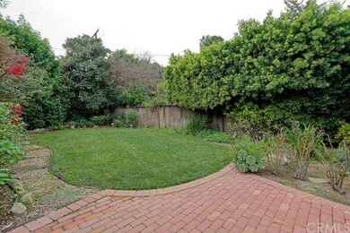 Sneak peek of the backyard- pavers, a landscaped g