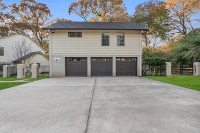 Wide driveway to fit multiple vehicles leading up to the 3 car garage.