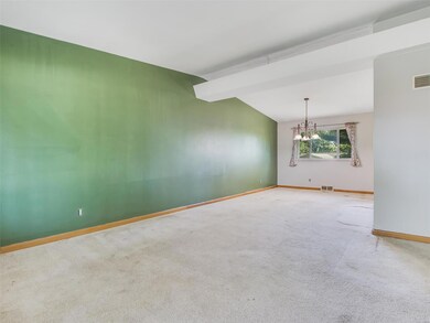 Living room, dining room with vaulted ceiling