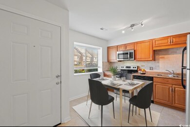 Kitchen featuring backsplash, sink, light tile pat
