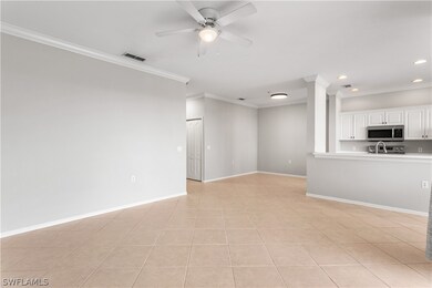 Unfurnished living room featuring sink, ceiling fa