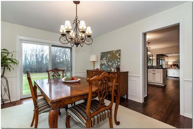 With wainscoting and newer flooring, the dining ro