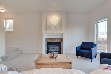 Gas fireplace with dentil molding mantle detail.