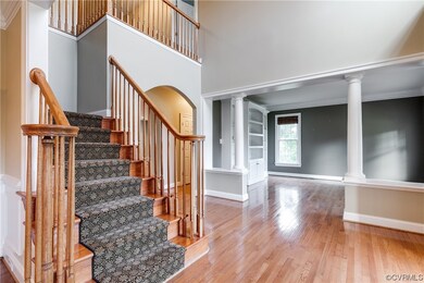 Two-story entry, way with hardwoods, looking into