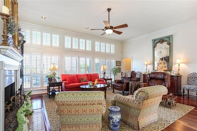 Large living room with wall of windows overlooking