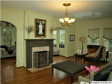 Triple archways to sunroom and foyer