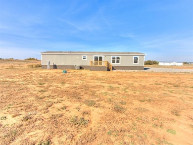 Back of property featuring a deck
