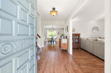 Entrance foyer with light wood-type flooring