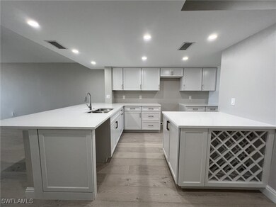 Kitchen featuring light wood finished floors, visi