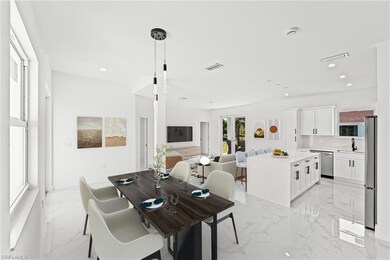 Dining area with light marble finish floors and recessed lighting