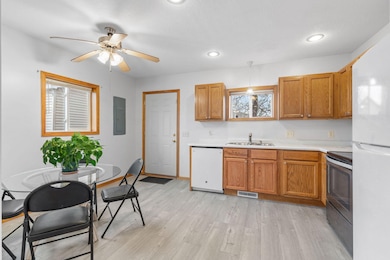 Eat-in kitchen with new LVP flooring and refreshed cabinets and countertops!