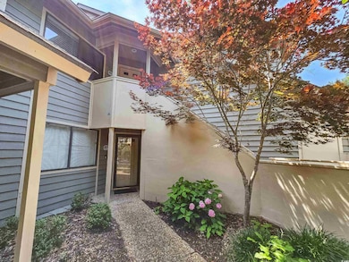 Doorway to property with stucco siding