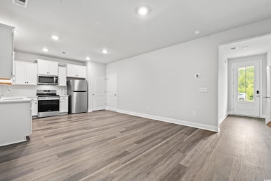 Unfurnished living room featuring light wood-style floors and recessed lighting