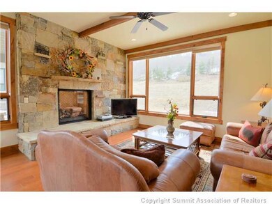 Living Room. Gather around the huge fireplace and