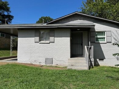 View of front of property featuring a front lawn