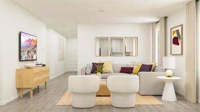 Living room with wood finished floors and baseboar