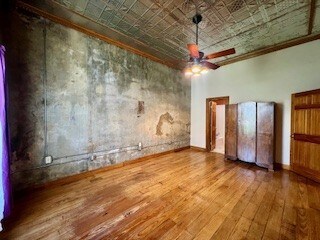 Spacious bedroom with original hardwood floors, ex