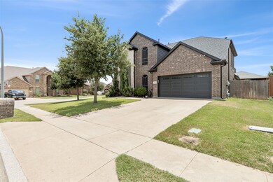 View of front of house featuring a garage and a fr