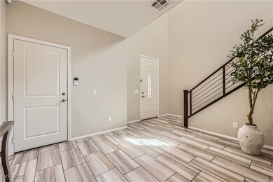Entrance foyer featuring wood finish floors, baseb
