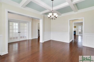 Dining room with coffered ceilings and view of the