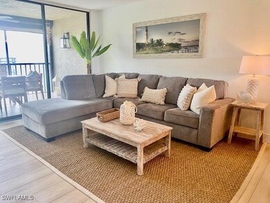 Living room featuring light wood-type flooring and expansive windows