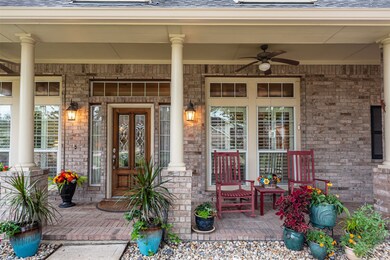 Large front porch is perfect for that morning cup of coffee and the fans keep it cool even during the summer.