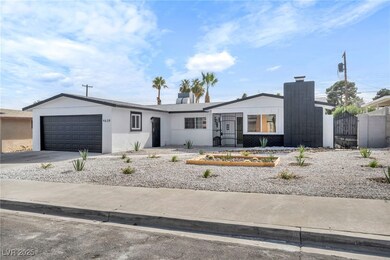 View of front of home featuring a garage, concrete