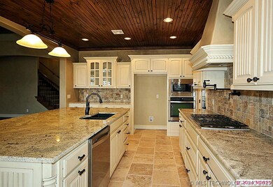 Travertine flooring, decorative trim on cabinets a