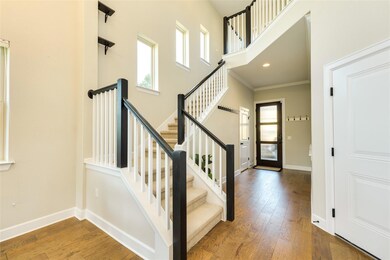 Stairway featuring ornamental molding, baseboards