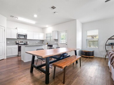 Dining area with dark wood finished floors